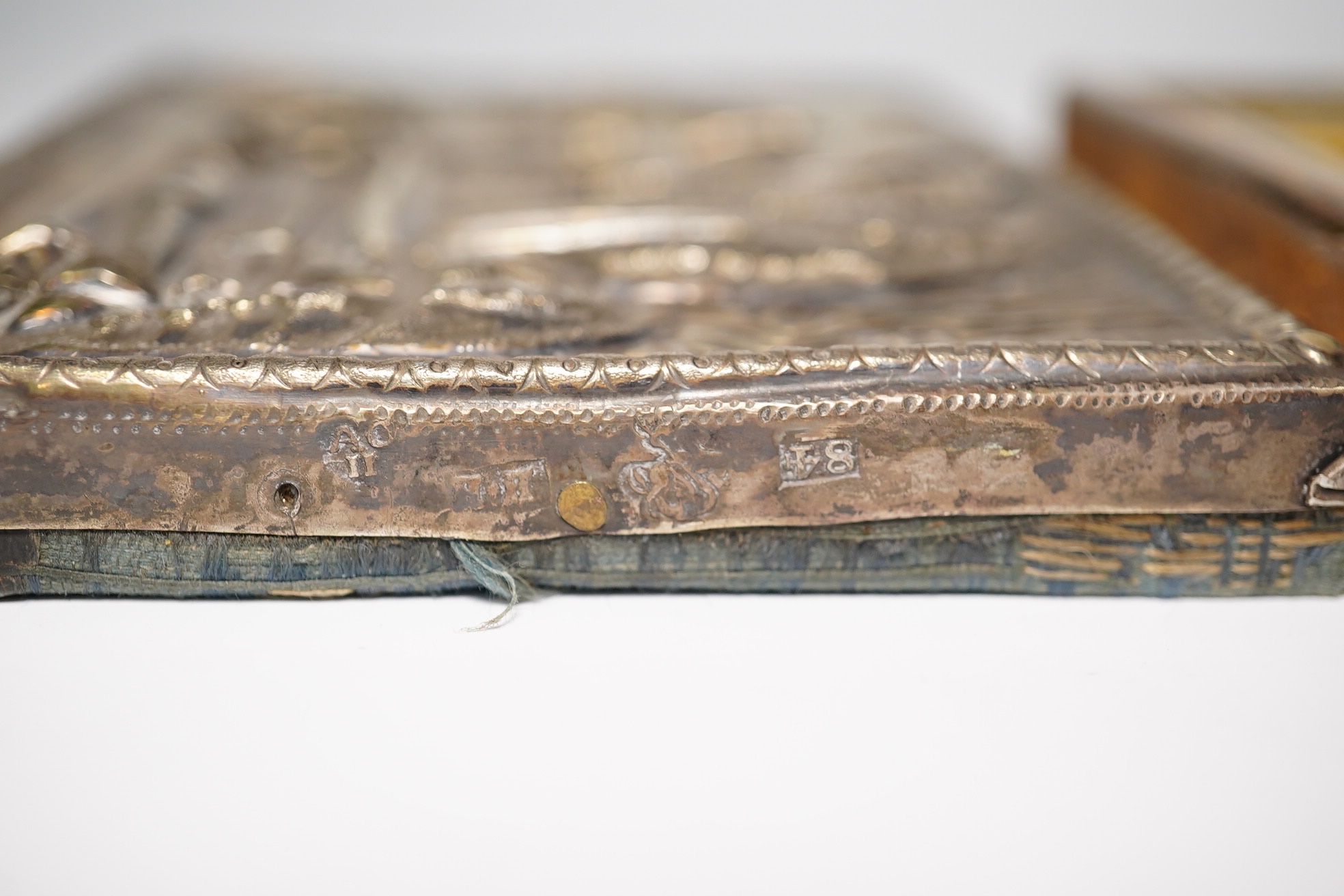 An 18th/19th century Russian silver overlaid icon together with another, largest 12 x 9cm. Condition - fair